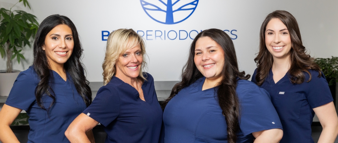 Periodontal team member explaining dental insurance coverage