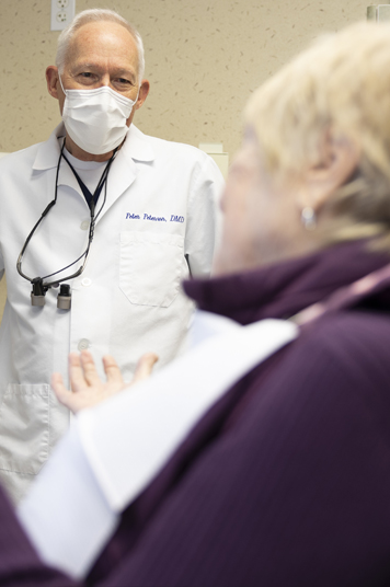 Dentist talking to dental patient