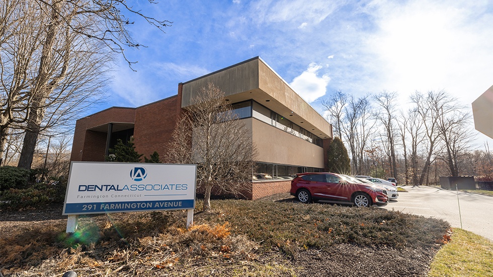 Outside view of P B S Periodontics building and parking lot