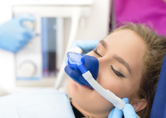 Woman relaxing with nitrous oxide sedation dentistry drip