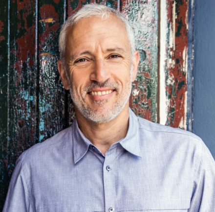 Man smiling after receiving periodontal therapy