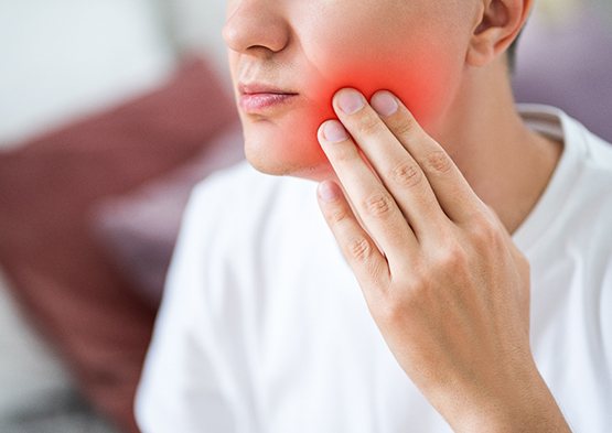 Closeup of patient experiencing jaw pain