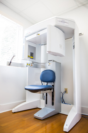 CBCT scanner and chair in periodontist’s office