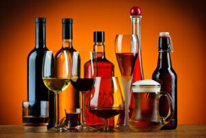 Various bottles and glasses of alcohol.
